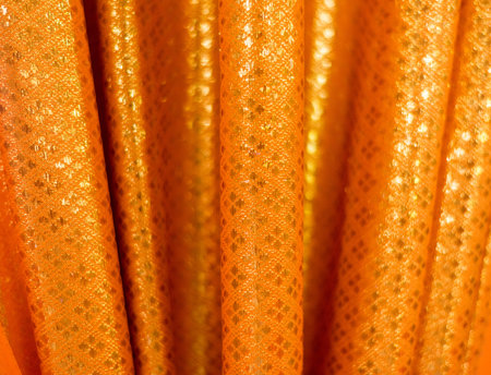 closeup gold cloth texture background and soft focusの写真素材
