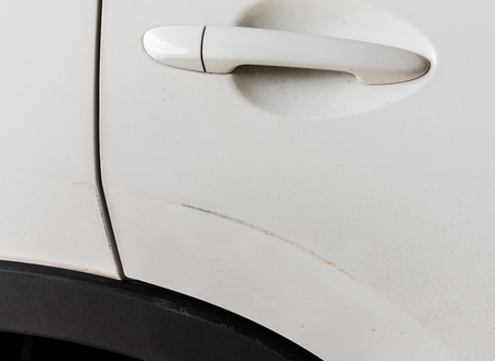 Scratched car paint with door handleの写真素材