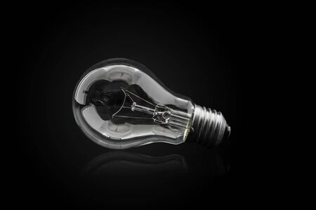 Light bulb, isolated on black backgroundの写真素材