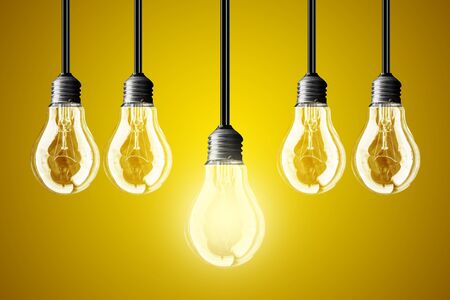 lightbulb Idea concept.yellow backgroundの写真素材