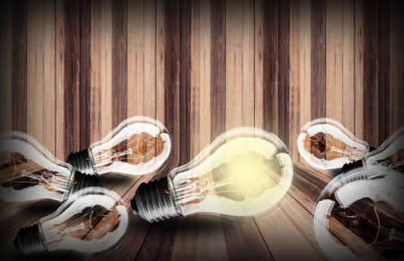 lightbulb  on wood planks texture background. Idea concept.の写真素材