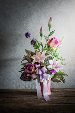 Still life with a beautiful bunch of Flowers with cobweb on wooden table. vintage toneの写真素材