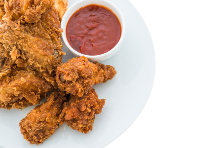 fried chicken is isolated on white backgroundの写真素材