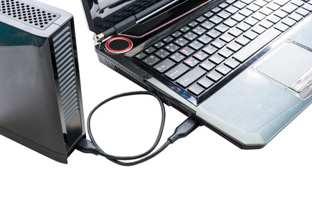 External hard drive connected to laptop on white background with clipping path