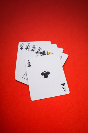 Playing cards isolated on red background with clipping path