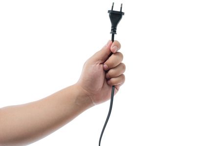 hand holding electric plug isolated on white background with clipping pathの写真素材