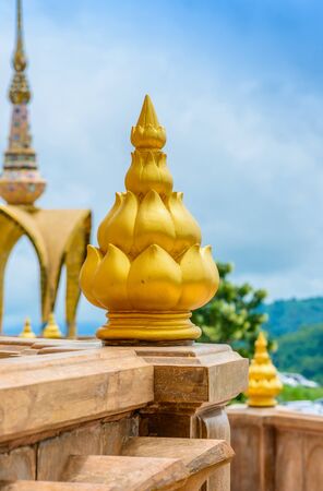 architecture of Wat Phra That Pha Son Kaew, PETCHRABOON province, THAILAND. buddhism crafts religions handwork on glass and ceramic tiles decoration on gold color pagoda surfaceの写真素材