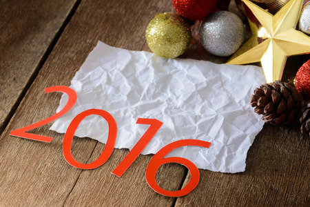 Letters 2016 and decorated Christmas tree on wooden wall backgroundの写真素材