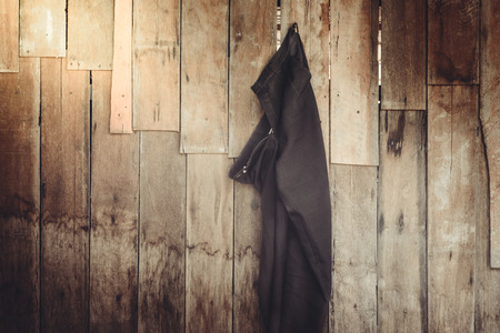 Vintage,Pants hanging on the wooden wall backgroundの写真素材