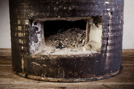 Antique charcoal stove on wooden floor. closeup shortの写真素材