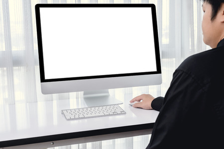 Men hand using computer mouse with blank computer screen