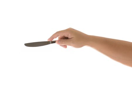 hand holding a knife to eat on an isolated white backgroundの写真素材
