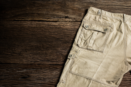 man casual pants on wooden backgroundの写真素材