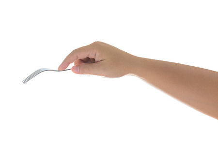 hand holding a silver fork isolated on white  backgroundの写真素材