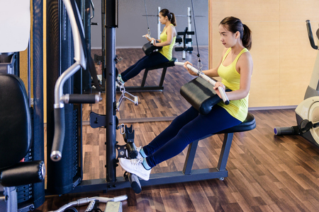 beautiful muscular fit woman exercising building muscles