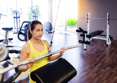 beautiful muscular fit woman exercising building muscles