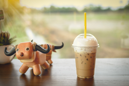 Ice coffee on a wooden tableの写真素材