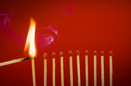 Burning matchsticks setting fire to its neighbors, a metaphor for ideas and inspiration