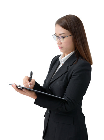 Business woman write on clipboard isolated on white backgroundの写真素材