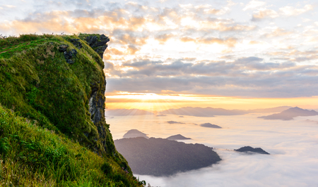 Sunrise and sea of mist at phucheefa forest park mountain at Phucheefa,Chiangrai province ,North of Thailand. " THE PEAK OF MOUTAIN POINT TO THE SKY "の写真素材