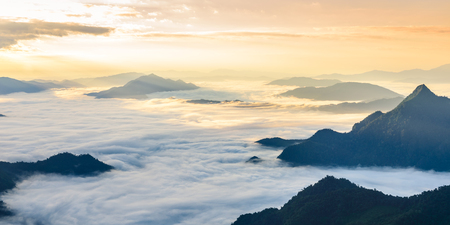 Sunrise and sea of mist, view from phucheefa forest park mountain at Phucheefa,Chiangrai province ,North of Thailand. " THE PEAK OF MOUTAIN POINT TO THE SKY "の写真素材