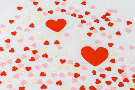 Beautiful valentines day background with red hearts on white background