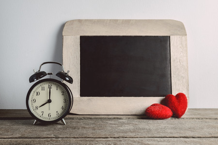 Alarm clock and chalk boad empty for your text. Back to school concept with copy spaceの写真素材