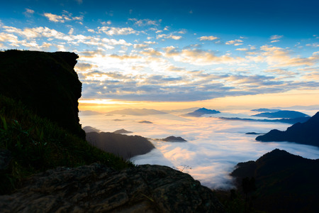 Sunrise and sea of mist at phucheefa forest park mountain at Phucheefa,Chiangrai province ,North of Thailand. " THE PEAK OF MOUTAIN POINT TO THE SKY "の写真素材
