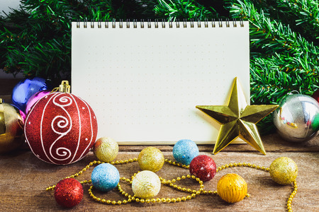 Christmas decoration, ornaments, theme with blank Notebook on wooden planks  backgroundの写真素材
