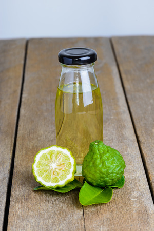 fresh bergamot fruit with Citrus bergamia and Bergamot essential oil on wooden table backgroundの写真素材