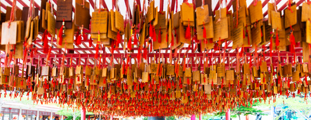Wooden sign for writing a wish at Dragon Descendants Meseum in Suphanburi Thailandのeditorial素材