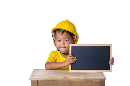 Asian children wearing safety helmet and smiling with chalkboard isolated on white background  ....