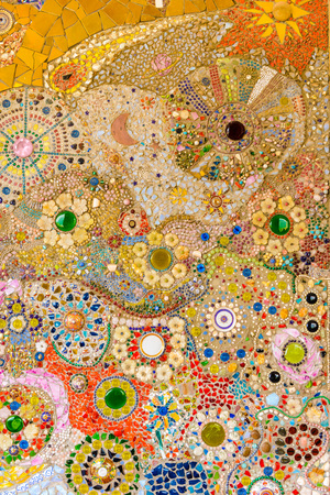 Close up Background of handwork on fancy colorful ceramic decorated the wall of buddhism pagoda in Wat Pha Son Kaew, Petchaboon Thailandの写真素材