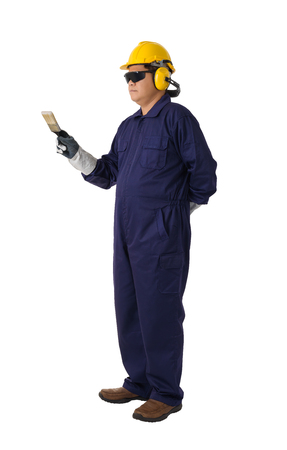 Full body portrait of a worker in Mechanic Jumpsuit is holding a paint brush with helmet, earmuffs, Protective gloves and Safety goggles isolated on white background clipping pathの写真素材