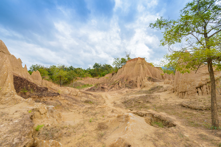 landscape of soil textures eroded sandstone pillars, columns and cliffs, natural erosion of water and wind, "Sao Din Na Noi"or "Hom Chom" and "Khok Suea" at sri nan national park in Nan Province, Thailandの写真素材
