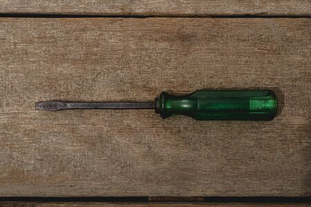 old wrench on wooden rustic grunge backgroundの写真素材
