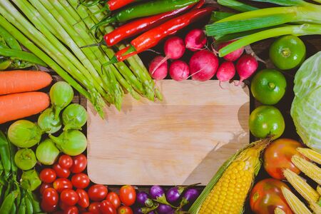 Backgroud of fresh food tasty and healthy varis vegetables are on the wooden table with space for your messageの写真素材