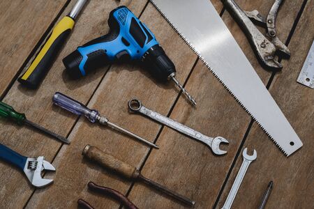 Top view of old instruments constructor or renovation for build and repair house on rustic grunge wooden backgroundの写真素材