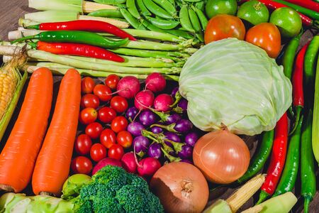 Backgroud group of fresh food tasty and healthy varis vegetables are on the wooden tableの写真素材