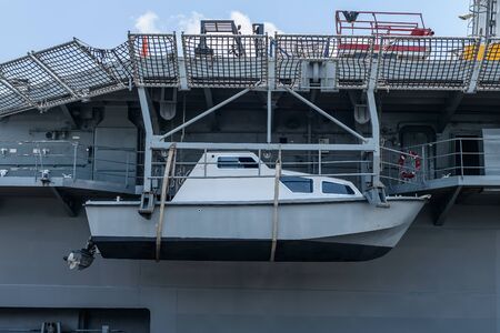 Closeup of Rescue ship or Lifeboat Hung on a battleship at Chakri Naruebet boat, battleship from the Thai port at Sattahipの写真素材