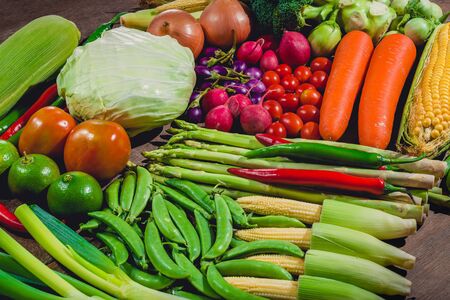Background group of fresh food tasty and healthy vegetables are on the wooden tableの写真素材