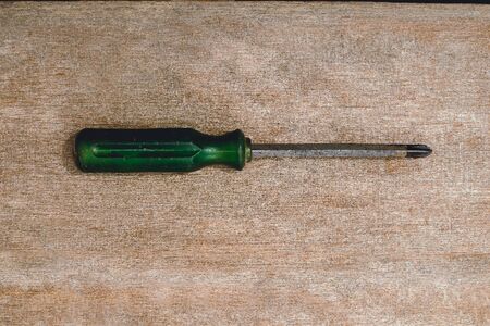 old wrench on wooden rustic grunge background