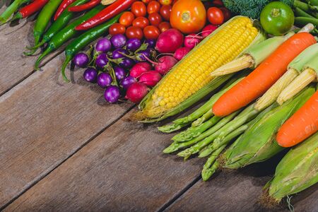 Backgroud of fresh food tasty and healthy varis vegetables are on the wooden table with space for your messageの写真素材