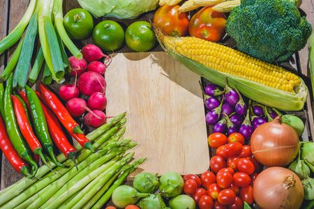 Backgroud of fresh food tasty and healthy varis vegetables are on the wooden table with space for your messageの写真素材