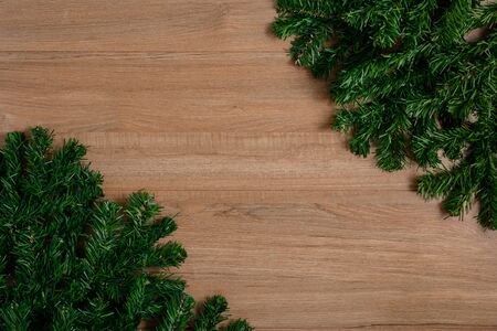 Fir branches on wooden board. Christmas or New year backgroundの写真素材