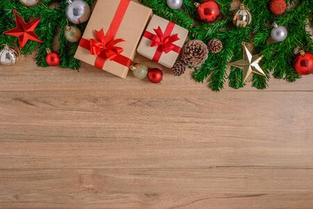 Christmas fir tree with decoration on wooden board. Top view with copy spaceの写真素材
