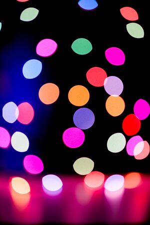 Abstract colorful defocused circular facula holiday bokeh. Abstract Christmas and new year backgroundの写真素材