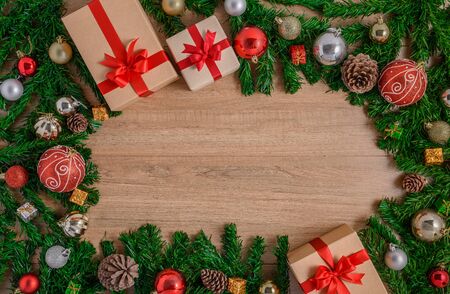 Christmas fir tree with decoration on wooden board. Top view with copy spaceの写真素材