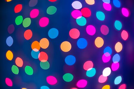 Abstract colorful defocused circular facula holiday bokeh. Abstract Christmas and new year backgroundの写真素材