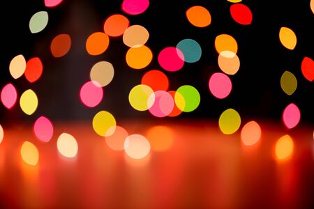Abstract colorful defocused circular facula holiday bokeh. Abstract Christmas and new year backgroundの写真素材